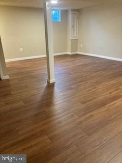 basement featuring dark wood-type flooring