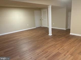 basement featuring dark wood-type flooring