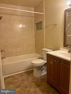 full bathroom featuring vanity, toilet, and tiled shower / bath combo