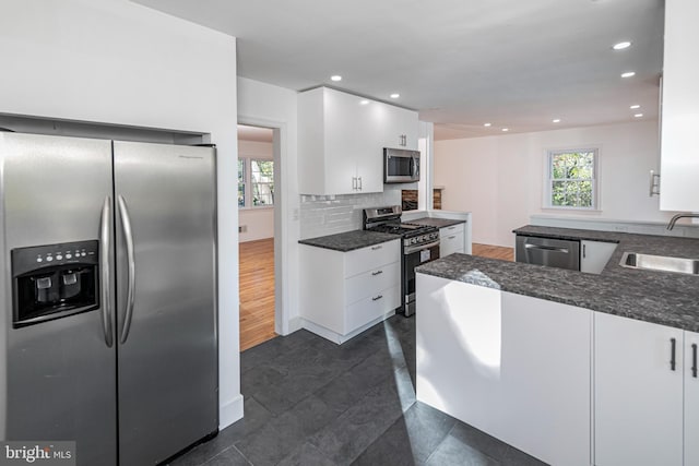 339 Hamilton Ave, Princeton, NJ 08540 - kitchen featuring stainless steel appliances, white cabinets, a sink, backsplash, and recessed lighting