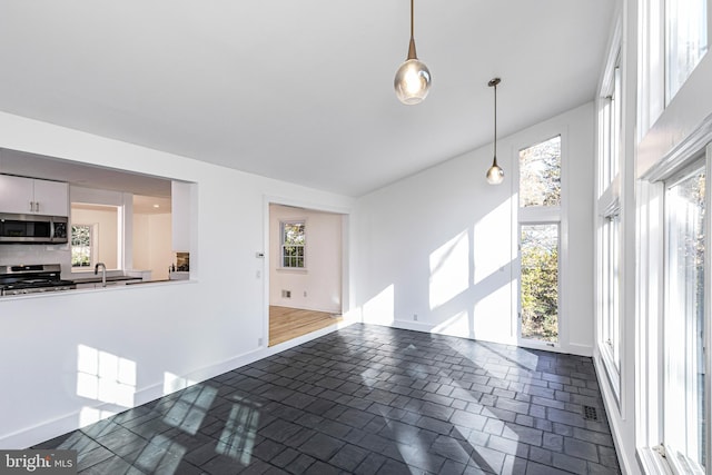 339 Hamilton Ave, Princeton, NJ 08540 - unfurnished living room with baseboards and a sink