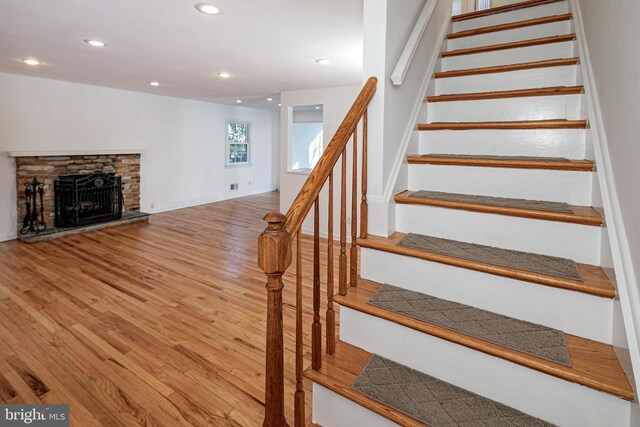 339 Hamilton Ave, Princeton, NJ 08540 - stairs featuring wood finished floors, recessed lighting, and a stone fireplace