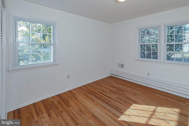 339 Hamilton Ave, Princeton, NJ 08540 - empty room with light wood-type flooring, a baseboard heating unit, and baseboards