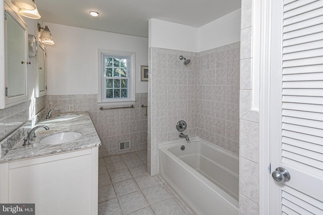 339 Hamilton Ave, Princeton, NJ 08540 - bathroom with tile patterned flooring, tub / shower combination, tile walls, double vanity, and wainscoting