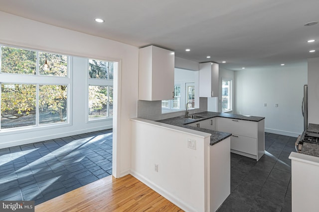 339 Hamilton Ave, Princeton, NJ 08540 - kitchen featuring a peninsula, a sink, white cabinetry, plenty of natural light, and recessed lighting