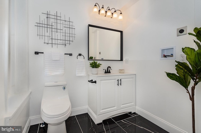 bathroom with vanity, tile patterned floors, and toilet