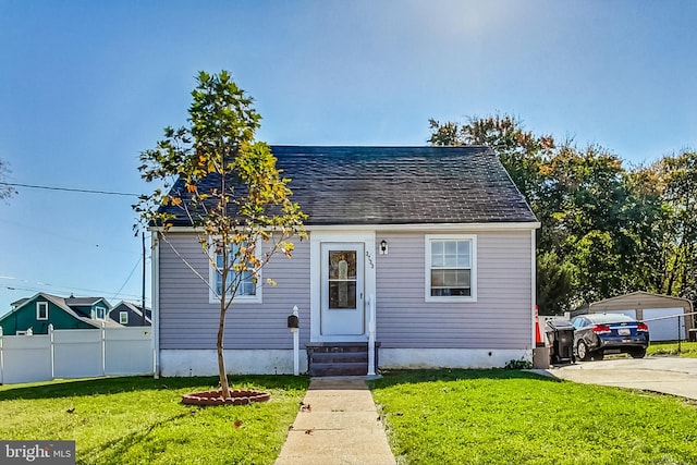 bungalow-style home with a front lawn