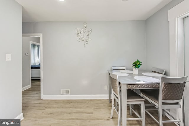 dining space featuring light hardwood / wood-style flooring