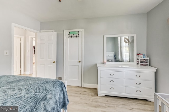 bedroom with light wood-type flooring