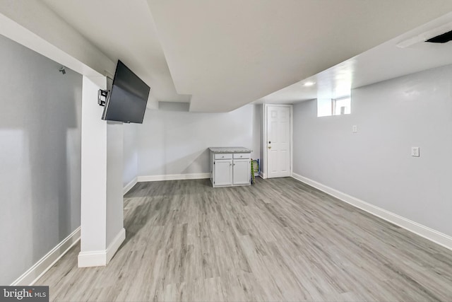 basement featuring light wood-type flooring