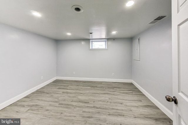 basement featuring light wood-type flooring