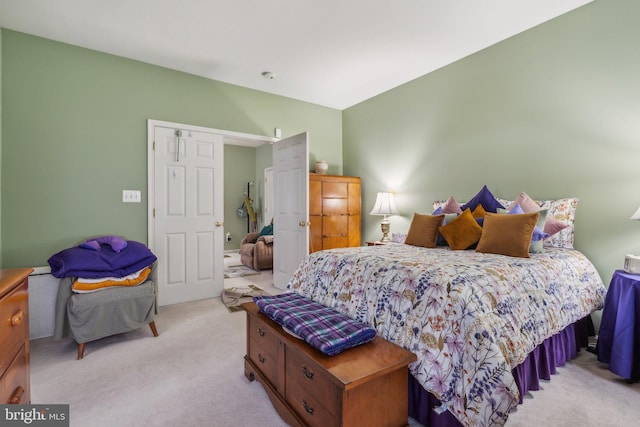 bedroom featuring light carpet