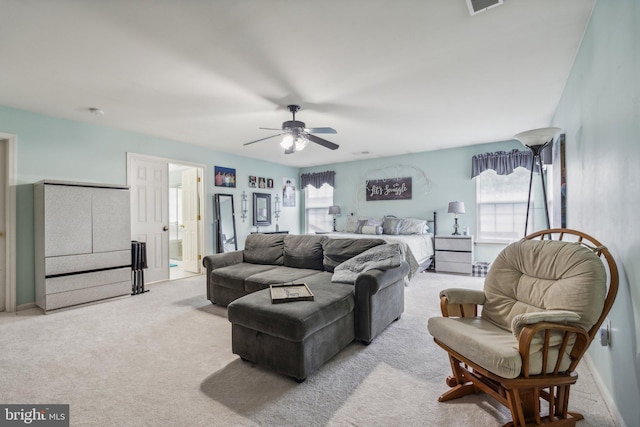 living room featuring ceiling fan and light colored carpet