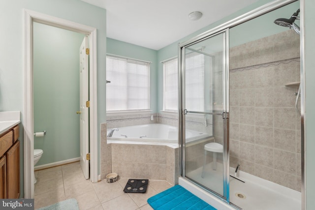 full bathroom featuring toilet, shower with separate bathtub, vanity, and tile patterned floors