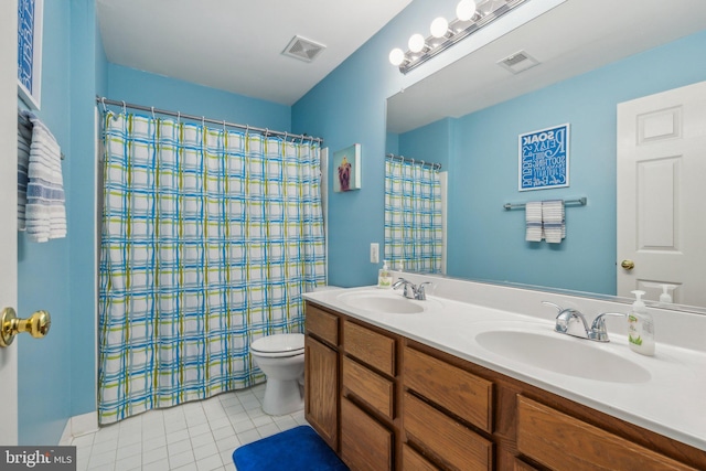 bathroom featuring vanity, tile patterned flooring, toilet, and a shower with curtain