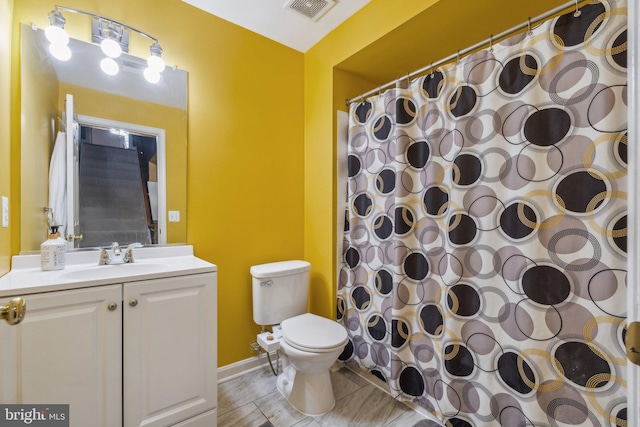 bathroom featuring vanity, toilet, and a shower with curtain