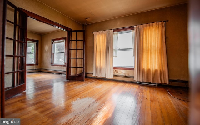 empty room with hardwood / wood-style floors