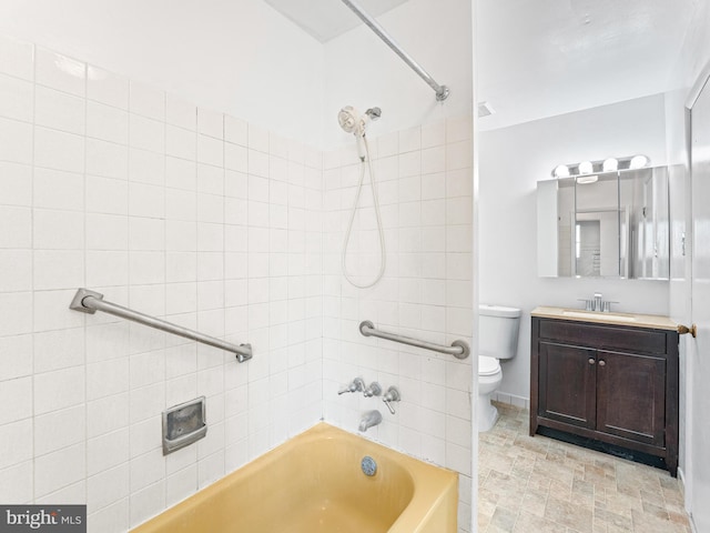 full bathroom with vanity, toilet, and tiled shower / bath