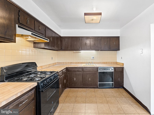 kitchen featuring backsplash, black appliances, sink, light tile patterned floors, and dark brown cabinetry