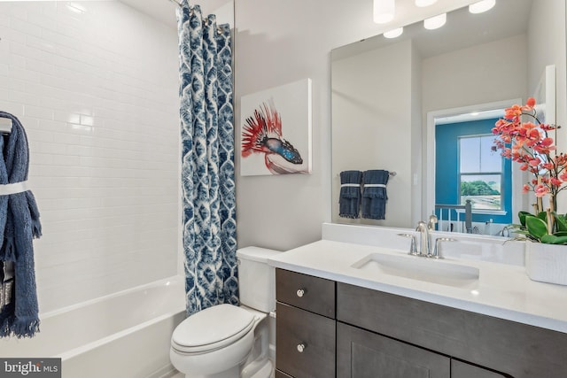 full bathroom with vanity, shower / bath combination with curtain, and toilet