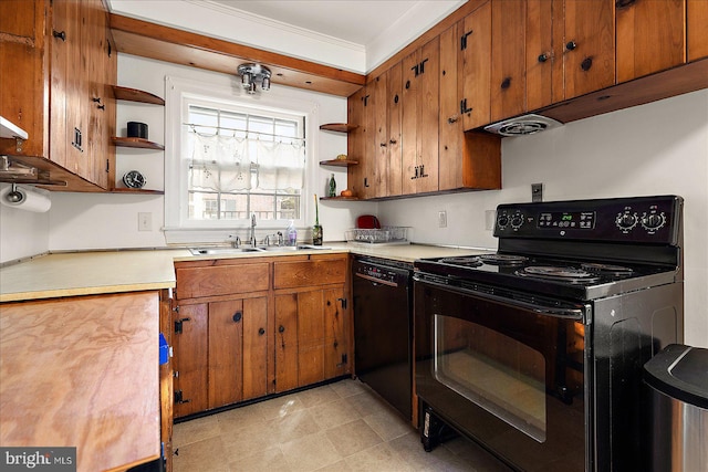 kitchen featuring black appliances, sink, and crown molding