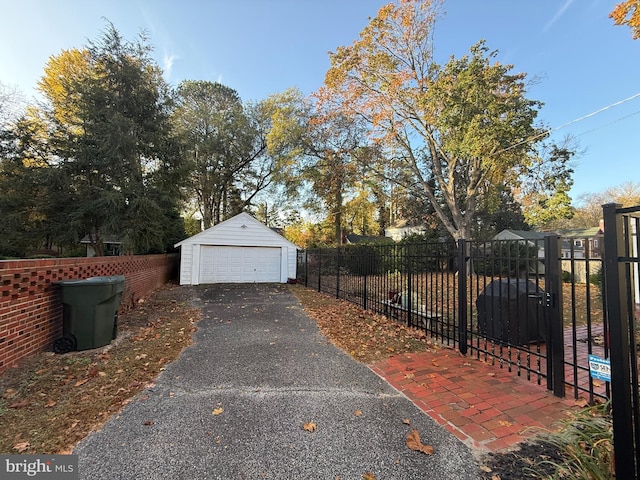 exterior space with a garage and an outdoor structure