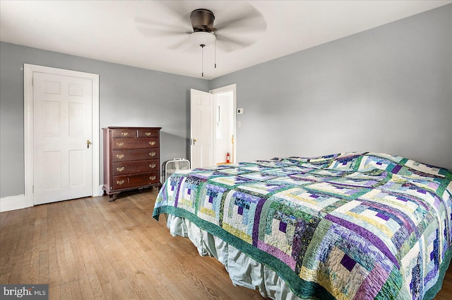 bedroom with ceiling fan and light wood-type flooring