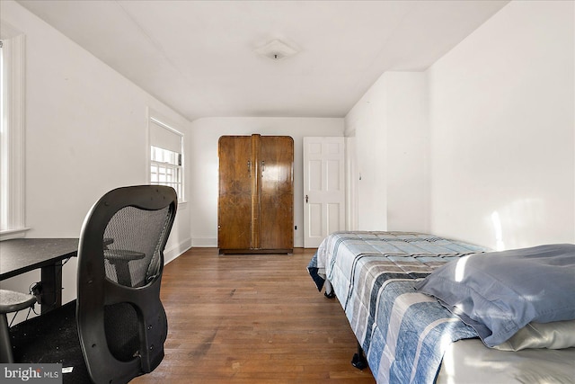 bedroom with wood-type flooring