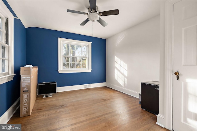 unfurnished bedroom featuring light hardwood / wood-style floors and ceiling fan