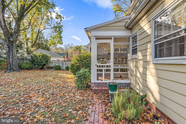 view of home's exterior featuring a sunroom