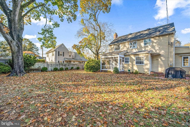 view of yard featuring a sunroom