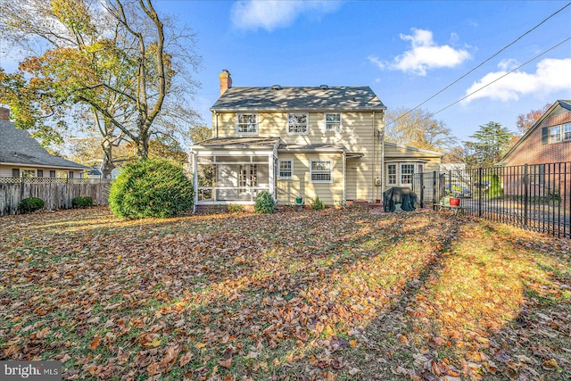 back of property featuring a sunroom