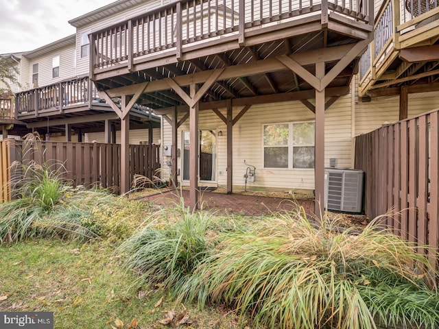 view of patio featuring central air condition unit and fence