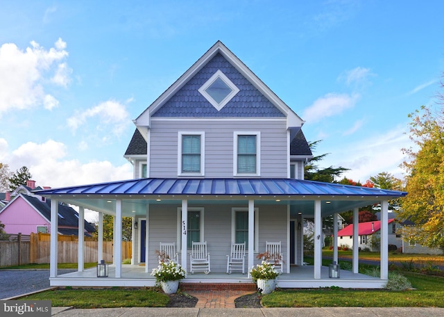 farmhouse inspired home with covered porch