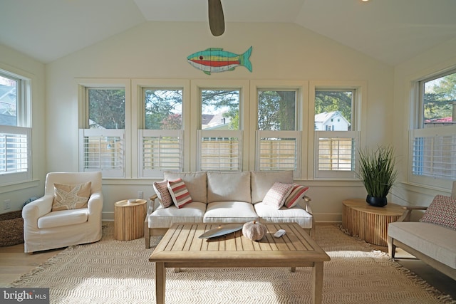 sunroom / solarium featuring a wealth of natural light and lofted ceiling