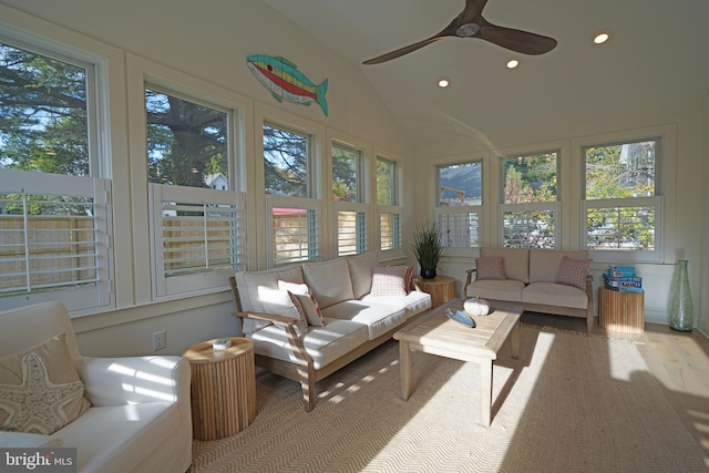 sunroom with ceiling fan, lofted ceiling, and a healthy amount of sunlight