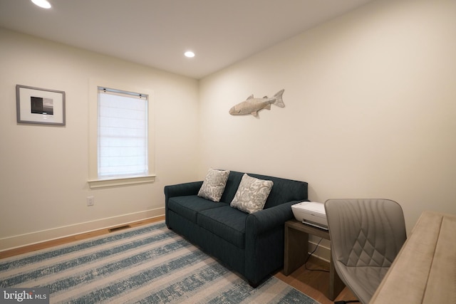 living area with wood-type flooring