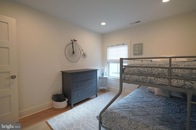 bedroom with light hardwood / wood-style floors