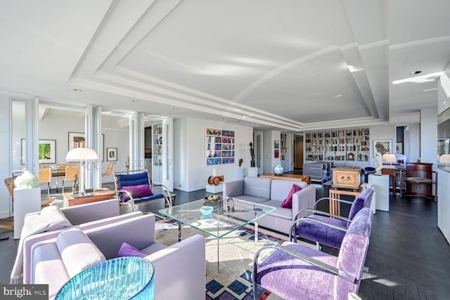 living room with a tray ceiling