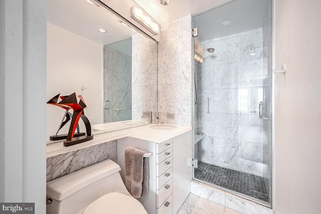 full bathroom featuring marble finish flooring, a shower stall, toilet, and vanity