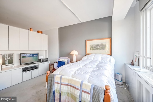 bedroom with light colored carpet