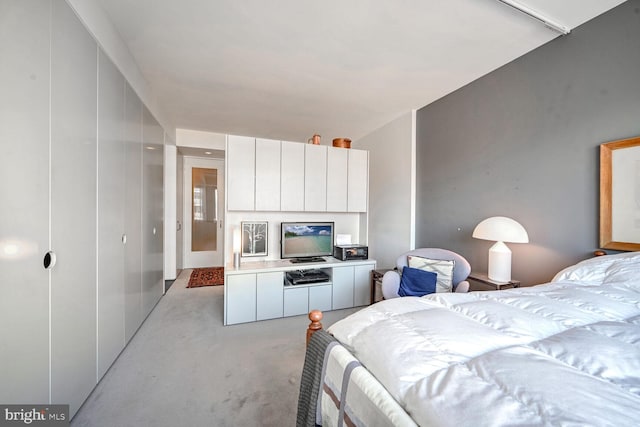 bedroom featuring light colored carpet