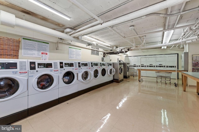 shared laundry room with separate washer and dryer