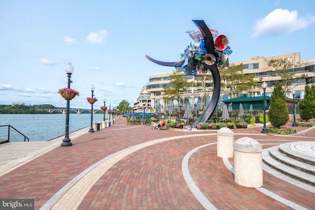 surrounding community featuring a water view