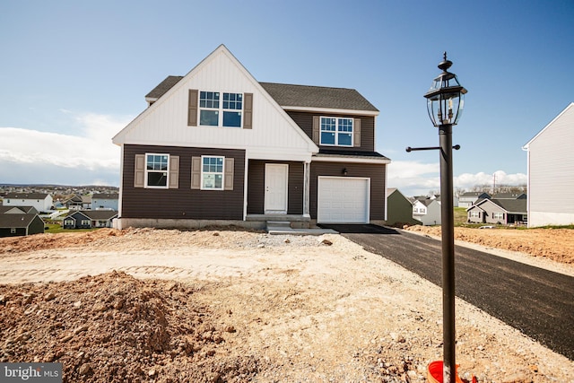 317 Valley View Cir Unit 98, York, PA 17408 - view of front of property featuring asphalt driveway, an attached garage, and board and batten siding