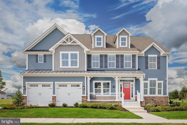 view of front facade featuring a garage, a porch, and a front lawn