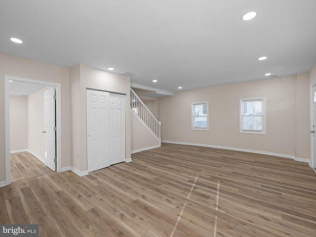 basement featuring light hardwood / wood-style floors