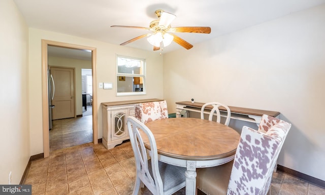 dining room featuring ceiling fan