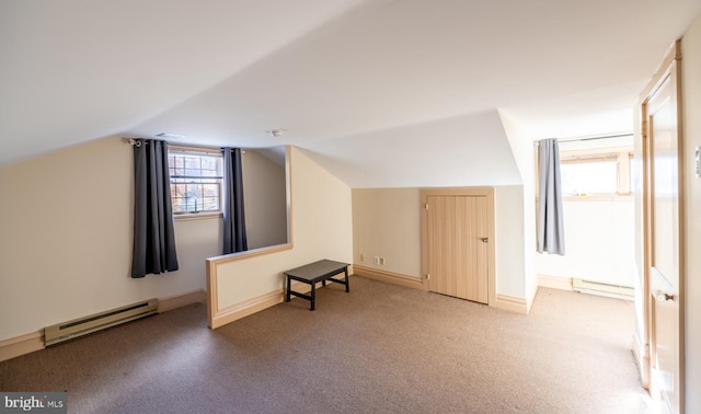 bonus room featuring a baseboard radiator, carpet floors, and vaulted ceiling