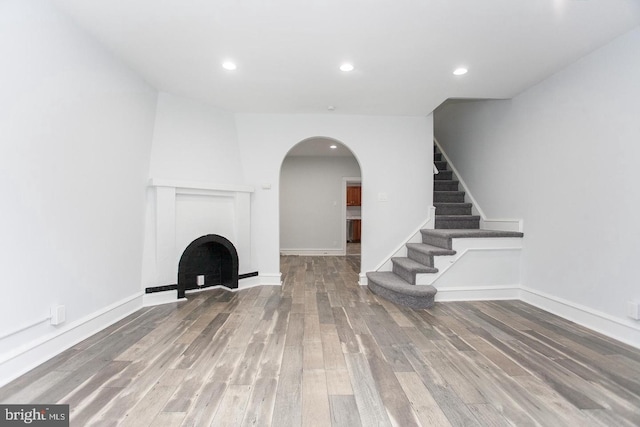 unfurnished living room with hardwood / wood-style flooring